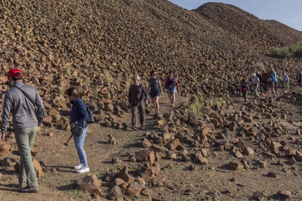 Visitors collecting agate and quartz minerals at Sidi Rahal mine on a mineral and geology day tour from Marrakech